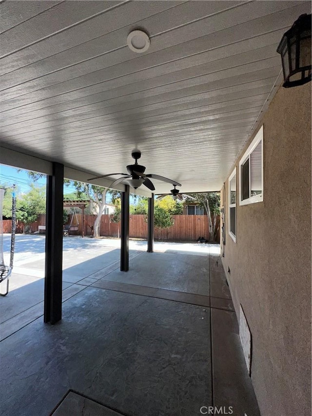 9387 Frankfort Ave, Fontana, CA 92335 - fenced backyard featuring a patio and ceiling fan