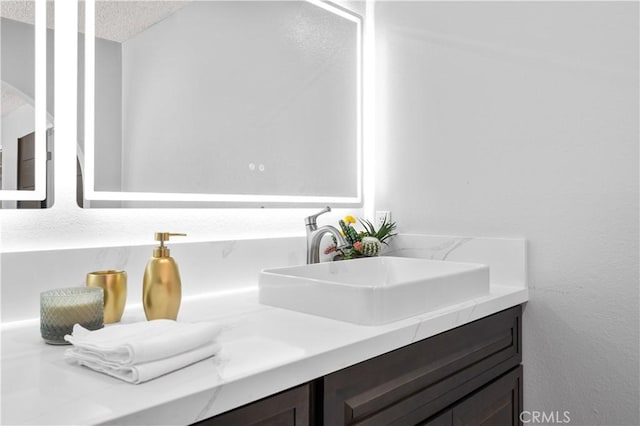 18561 Bert Rd, Riverside, CA 92508 - bathroom featuring vanity and a textured ceiling