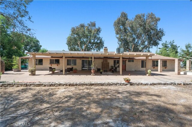 18561 Bert Rd, Riverside, CA 92508 - rear view of property featuring a patio area and stucco siding