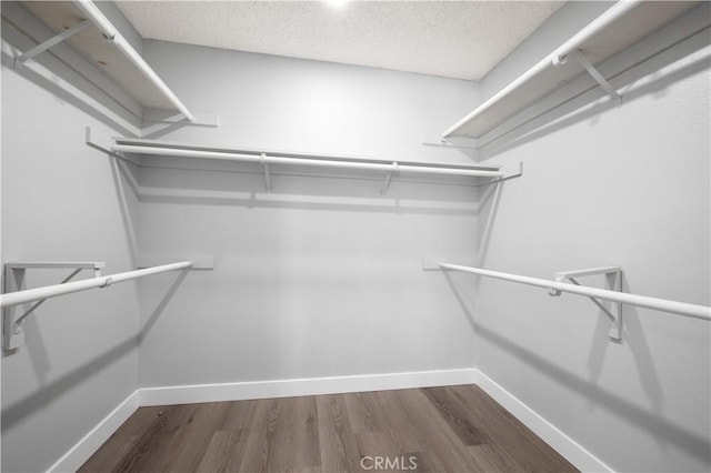 18561 Bert Rd, Riverside, CA 92508 - walk in closet featuring dark wood finished floors