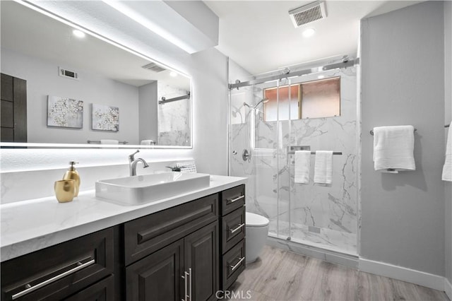 18561 Bert Rd, Riverside, CA 92508 - bathroom with vanity, a marble finish shower, and wood finished floors