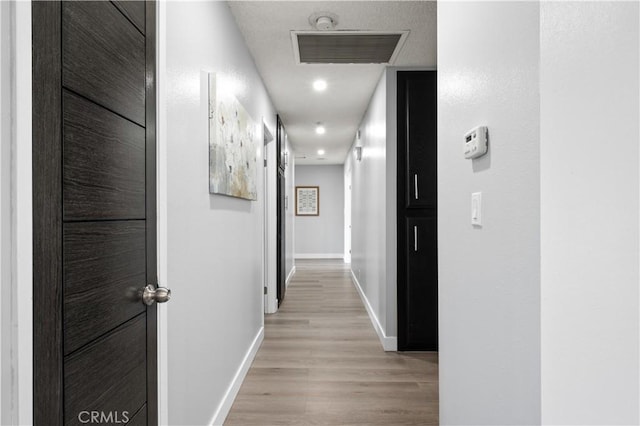 18561 Bert Rd, Riverside, CA 92508 - hallway with baseboards and light wood-type flooring