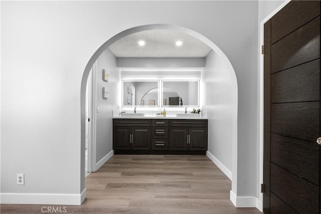 18561 Bert Rd, Riverside, CA 92508 - bar area with arched walkways and light wood-style floors