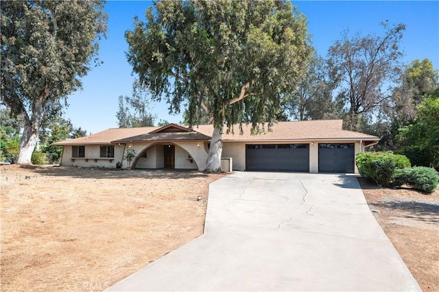 18561 Bert Rd, Riverside, CA 92508 - ranch-style home with a garage, driveway, and stucco siding