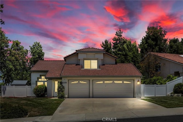 31752 Poole Ct, Temecula, CA 92591 - mediterranean / spanish-style home with a tile roof, an attached garage, driveway, and stucco siding