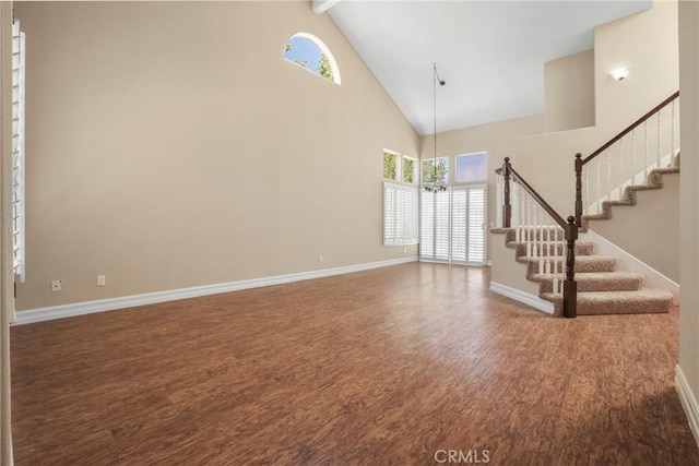 31752 Poole Ct, Temecula, CA 92591 - foyer featuring high vaulted ceiling, wood finished floors, stairs, healthy amount of natural light, and beamed ceiling