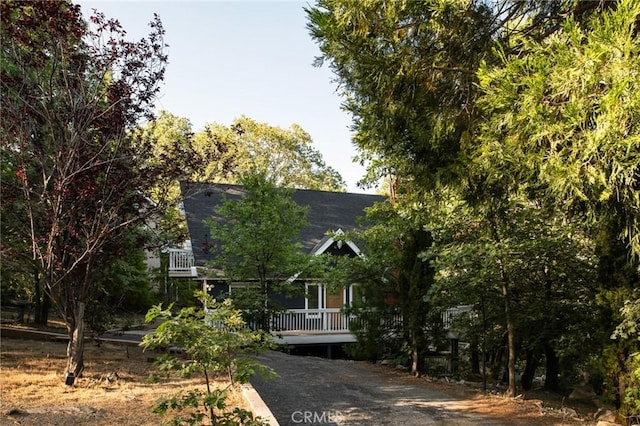 27984 St Bernard Ln, Lake Arrowhead, CA 92352 - obstructed view of property featuring a shingled roof