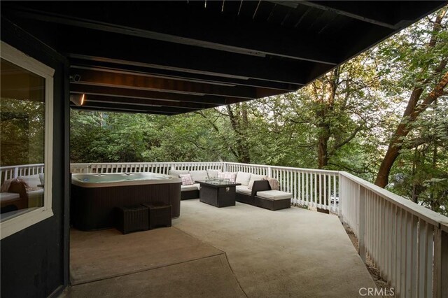 27984 St Bernard Ln, Lake Arrowhead, CA 92352 - view of patio / terrace featuring a hot tub and an outdoor hangout area
