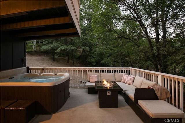 27984 St Bernard Ln, Lake Arrowhead, CA 92352 - view of patio featuring a hot tub and an outdoor living space with a fire pit