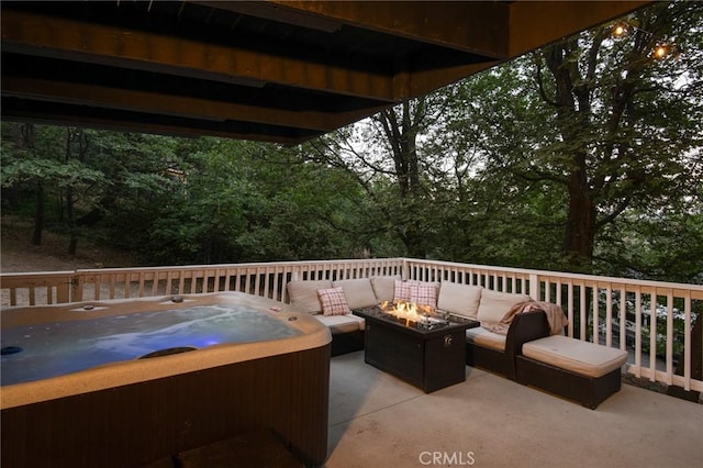 27984 St Bernard Ln, Lake Arrowhead, CA 92352 - view of patio featuring a hot tub and an outdoor living space with a fire pit