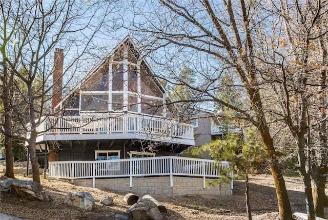 27984 St Bernard Ln, Lake Arrowhead, CA 92352 - back of property with a deck