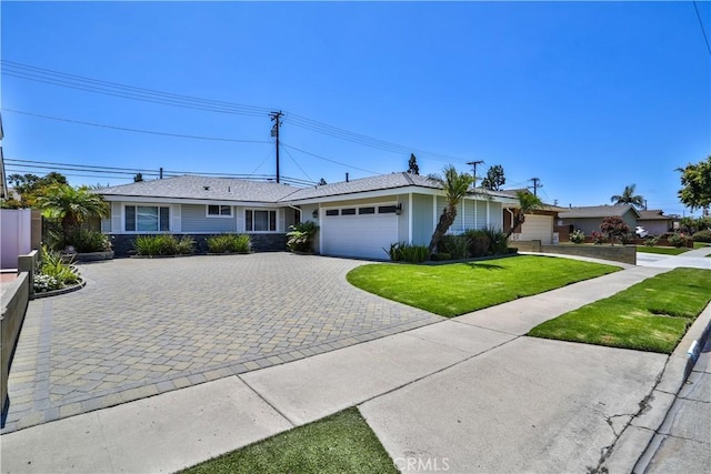 12682 Saint Mark St, Garden Grove, CA 92845 - single story home featuring a garage, decorative driveway, and a front lawn
