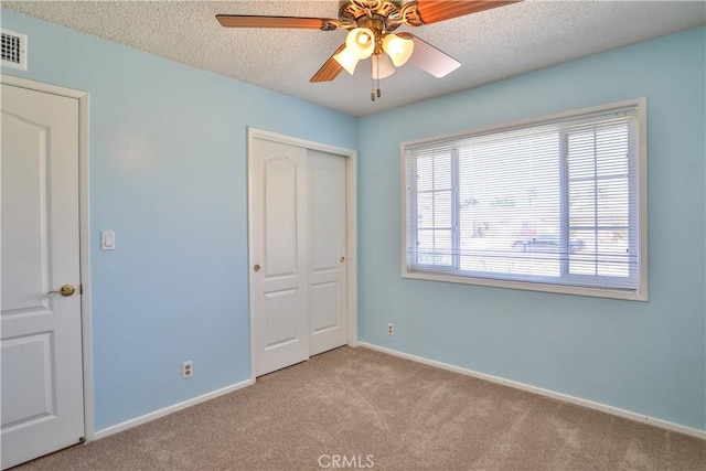 12682 Saint Mark St, Garden Grove, CA 92845 - unfurnished bedroom with carpet, a closet, a textured ceiling, and ceiling fan