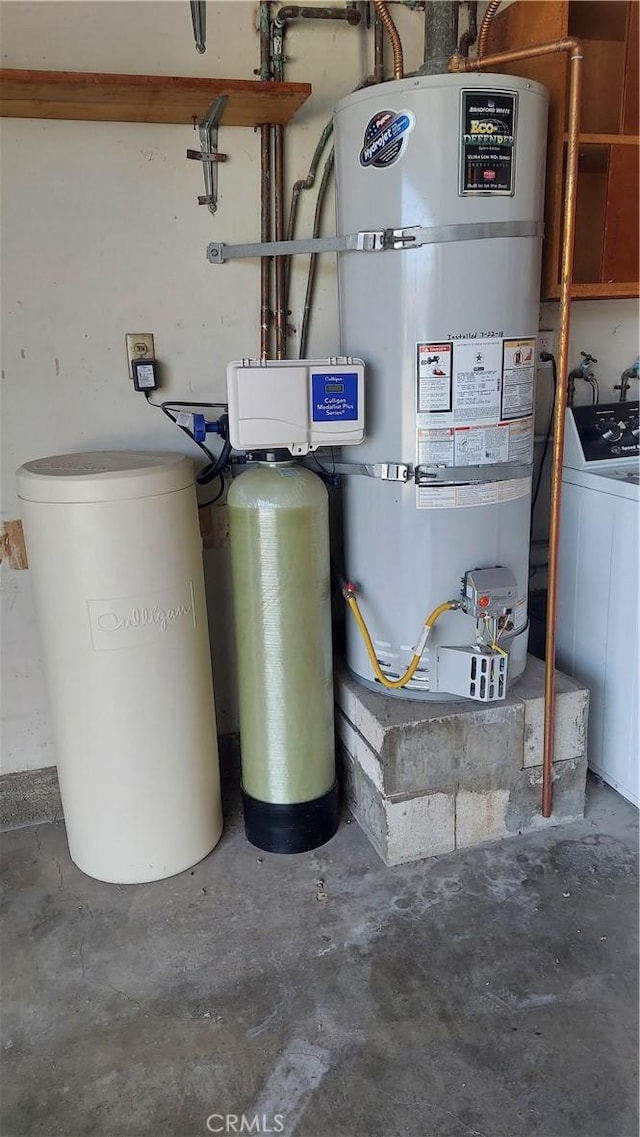 12682 Saint Mark St, Garden Grove, CA 92845 - utility room featuring strapped water heater and washer / dryer