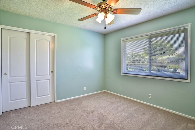 12682 Saint Mark St, Garden Grove, CA 92845 - unfurnished bedroom with carpet flooring, a closet, a textured ceiling, and ceiling fan