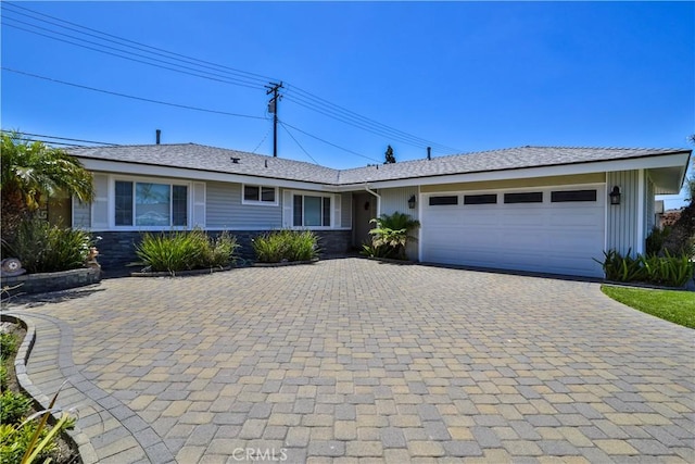 12682 Saint Mark St, Garden Grove, CA 92845 - ranch-style house featuring decorative driveway, a garage, and stone siding