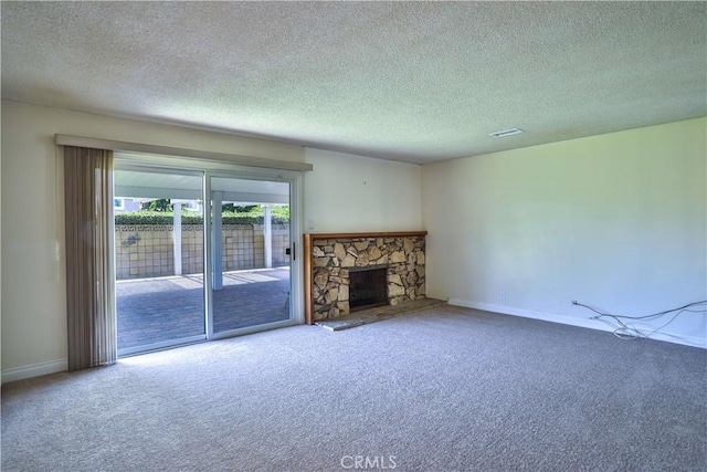 12682 Saint Mark St, Garden Grove, CA 92845 - unfurnished living room with carpet, a textured ceiling, and a stone fireplace