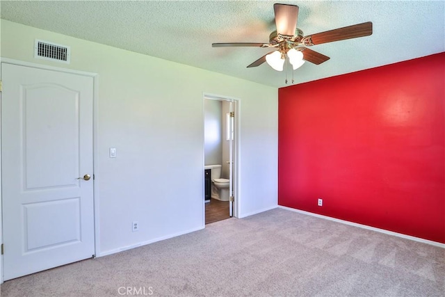12682 Saint Mark St, Garden Grove, CA 92845 - unfurnished bedroom with carpet floors, a textured ceiling, connected bathroom, and a ceiling fan