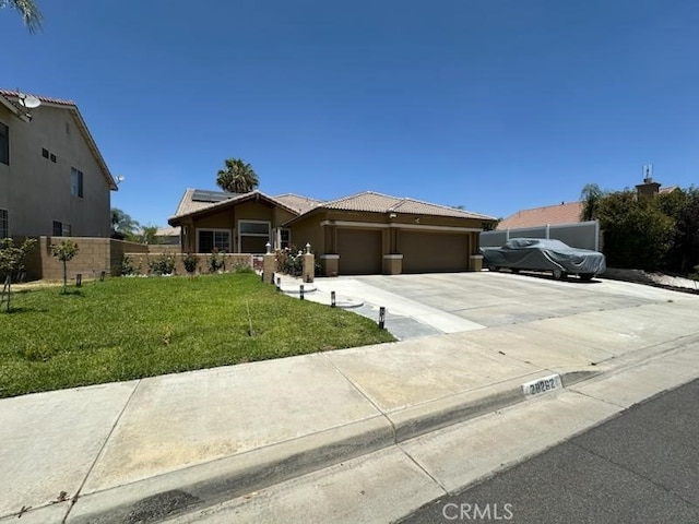 28262 Cider, Menifee, CA 92585 - single story home with a garage, driveway, roof mounted solar panels, a tiled roof, and stucco siding