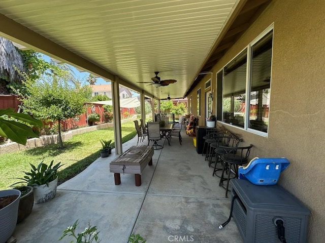 28262 Cider, Menifee, CA 92585 - fenced backyard with outdoor dining area, ceiling fan, and a patio area