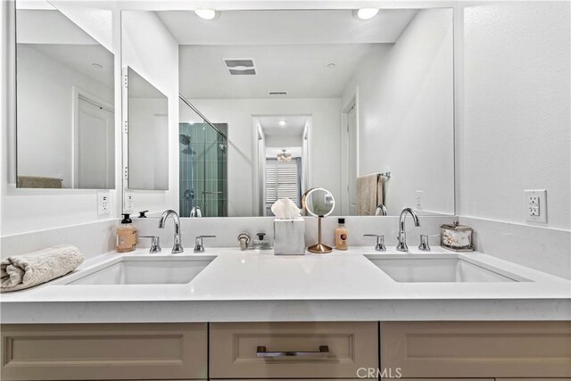 1309 Doheny Way, Dana Point, CA 92629 - bathroom featuring double vanity and a shower stall