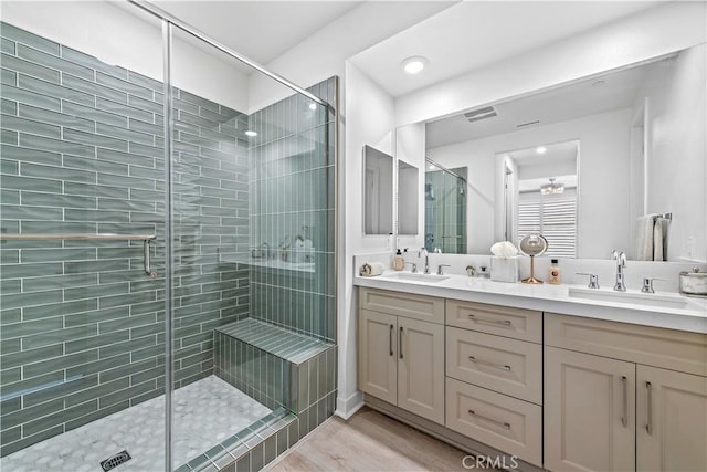 1309 Doheny Way, Dana Point, CA 92629 - full bath with double vanity, a stall shower, and wood finished floors