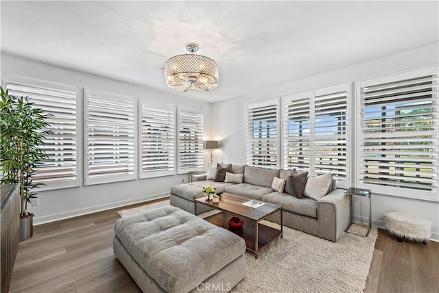 1309 Doheny Way, Dana Point, CA 92629 - living area with healthy amount of natural light, wood finished floors, and a chandelier