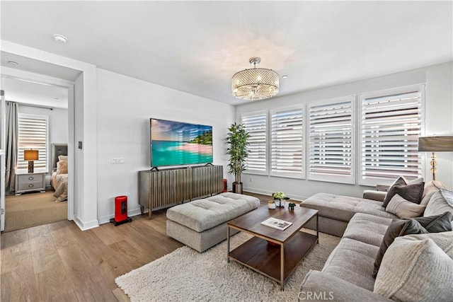 1309 Doheny Way, Dana Point, CA 92629 - living room featuring wood finished floors and a chandelier