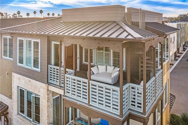 1309 Doheny Way, Dana Point, CA 92629 - rear view of house with a standing seam roof, stone siding, and a metal roof