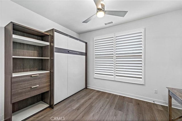 1309 Doheny Way, Dana Point, CA 92629 - unfurnished bedroom with wood finished floors, a closet, and a ceiling fan