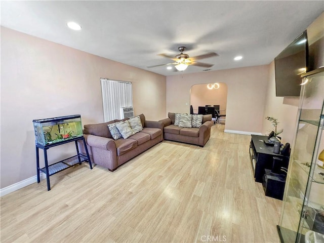 9313 Dearborn Ave, South Gate, CA 90280 - living room featuring arched walkways, light wood-type flooring, ceiling fan, and recessed lighting