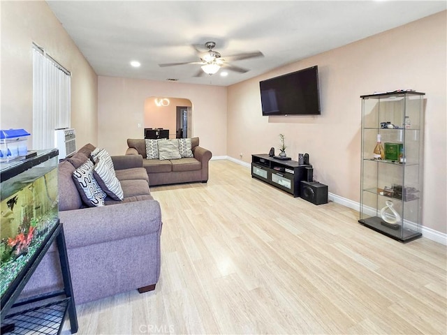 9313 Dearborn Ave, South Gate, CA 90280 - living area with arched walkways, wood finished floors, ceiling fan, and recessed lighting