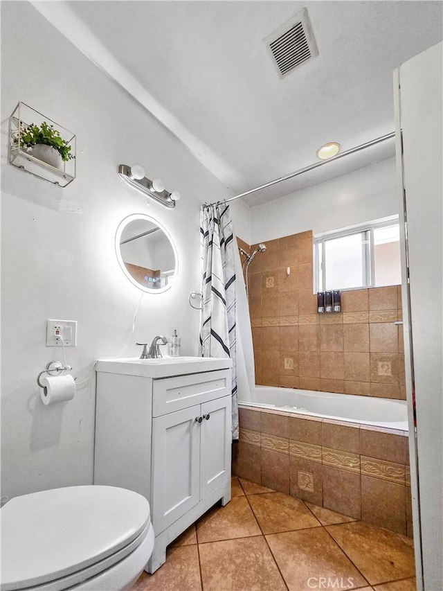 9313 Dearborn Ave, South Gate, CA 90280 - bathroom featuring tile patterned floors, vanity, and tiled shower / bath combo