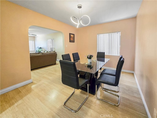 9313 Dearborn Ave, South Gate, CA 90280 - dining room with arched walkways and wood finished floors