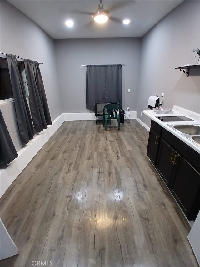 9313 Dearborn Ave, South Gate, CA 90280 - kitchen featuring dark cabinetry, wood finished floors, light countertops, recessed lighting, and ceiling fan