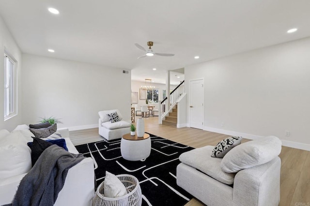 5471 Papagallo Dr, Oceanside, CA 92057 - living area with stairway, a ceiling fan, light wood finished floors, a chandelier, and recessed lighting