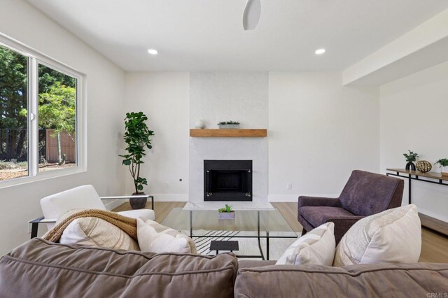 5471 Papagallo Dr, Oceanside, CA 92057 - living area with wood finished floors, a fireplace, and recessed lighting