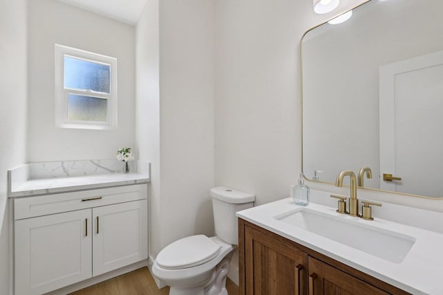 5471 Papagallo Dr, Oceanside, CA 92057 - half bathroom with vanity and wood finished floors