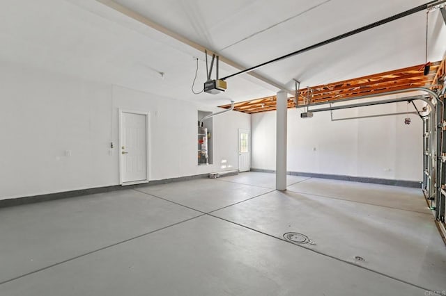 5471 Papagallo Dr, Oceanside, CA 92057 - garage featuring gas water heater and a garage door opener