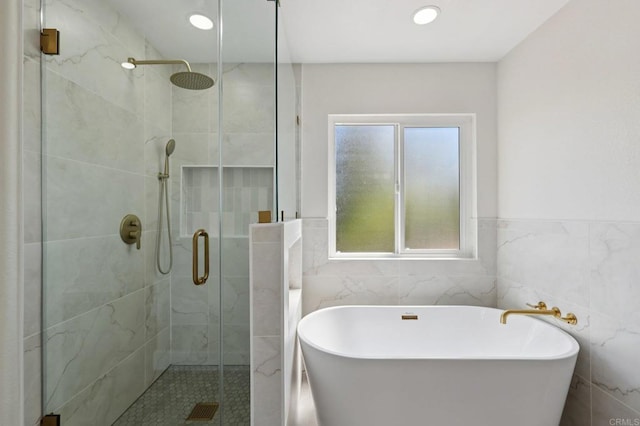 5471 Papagallo Dr, Oceanside, CA 92057 - full bathroom with a stall shower, a soaking tub, tile walls, and recessed lighting