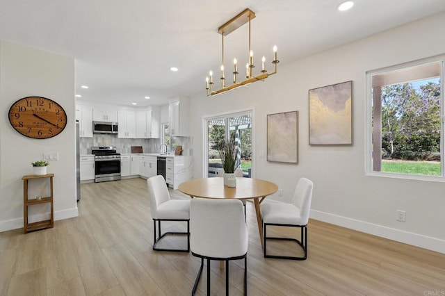 5471 Papagallo Dr, Oceanside, CA 92057 - dining room featuring light wood-style flooring, recessed lighting, and a chandelier