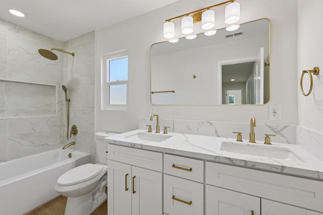 5471 Papagallo Dr, Oceanside, CA 92057 - bathroom with double vanity, shower / tub combination, and wood finished floors