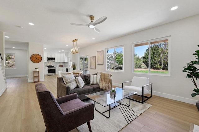 5471 Papagallo Dr, Oceanside, CA 92057 - living room with a ceiling fan, light wood finished floors, recessed lighting, and a chandelier