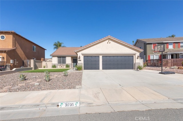 31735 Mesa View Dr, Menifee, CA 92584 - view of front of home with an attached garage, concrete driveway, stucco siding, and a tiled roof