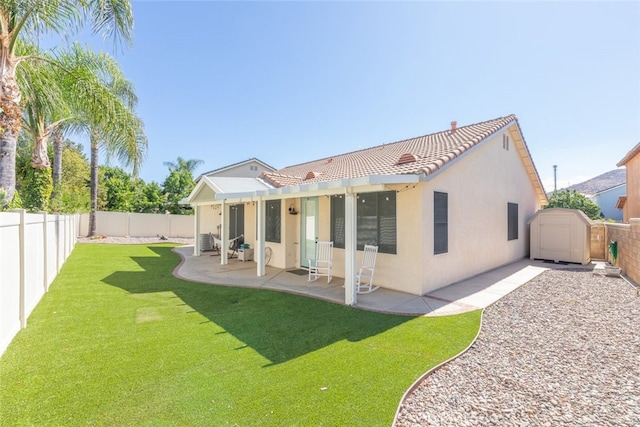 31735 Mesa View Dr, Menifee, CA 92584 - back of house featuring a tile roof, a fenced backyard, stucco siding, and a patio area