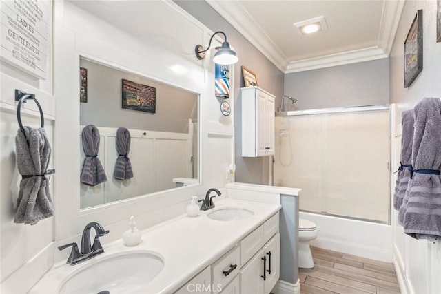 31735 Mesa View Dr, Menifee, CA 92584 - full bathroom featuring ornamental molding, double vanity, shower / bath combination with glass door, and wood finished floors