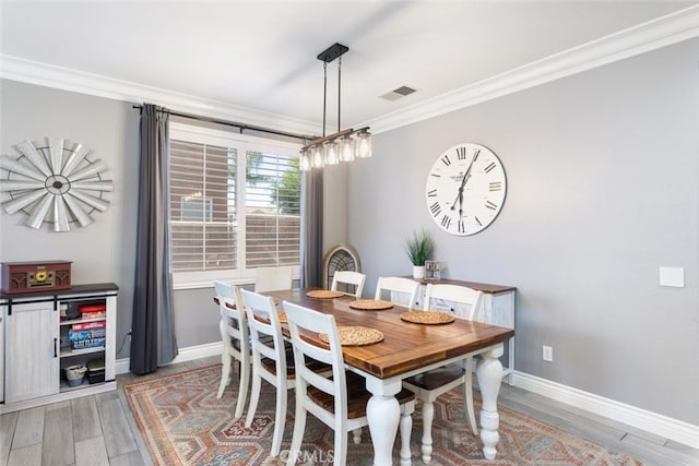 31735 Mesa View Dr, Menifee, CA 92584 - dining space with ornamental molding and light wood-style flooring