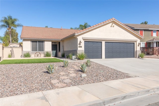 31735 Mesa View Dr, Menifee, CA 92584 - view of front of house featuring a garage, stucco siding, concrete driveway, and a tiled roof