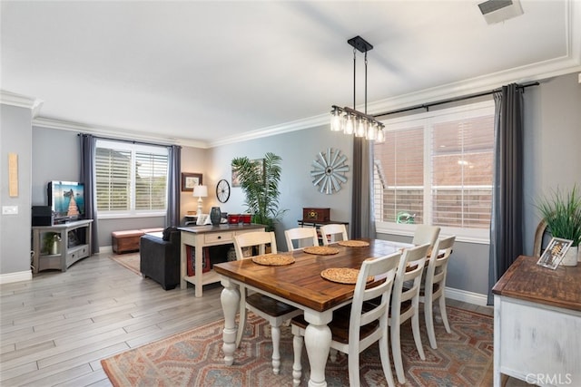 31735 Mesa View Dr, Menifee, CA 92584 - dining area featuring ornamental molding and light wood-style floors