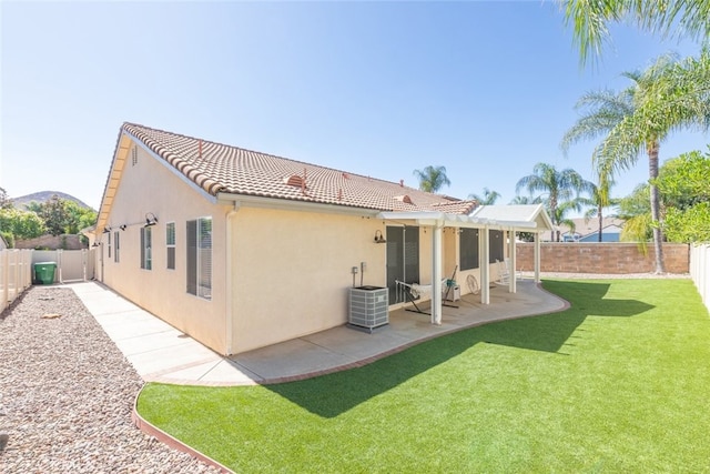 31735 Mesa View Dr, Menifee, CA 92584 - rear view of property featuring stucco siding, a tiled roof, a fenced backyard, and a patio